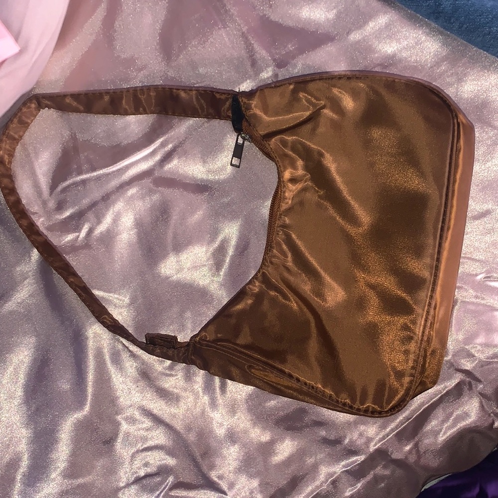 Brown small hand bag very cute but unused at all was 13 but will do 10$